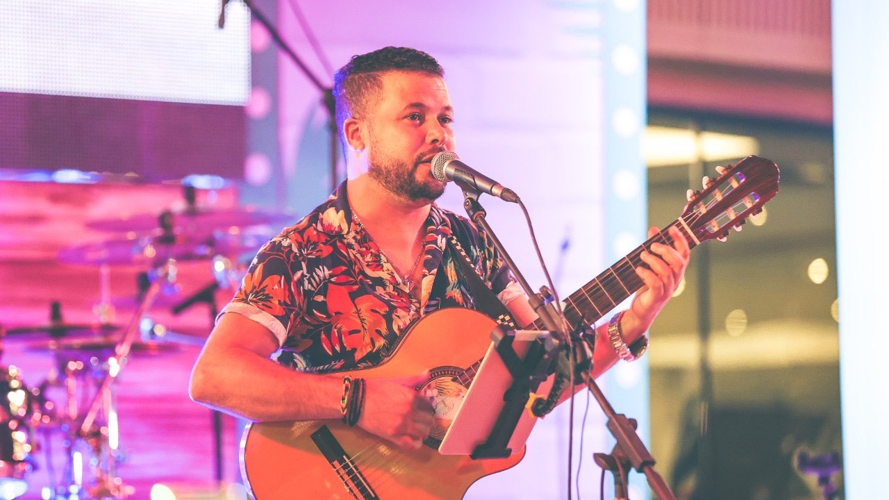 TITO singing and playing guitar live at The Theatre Dubai